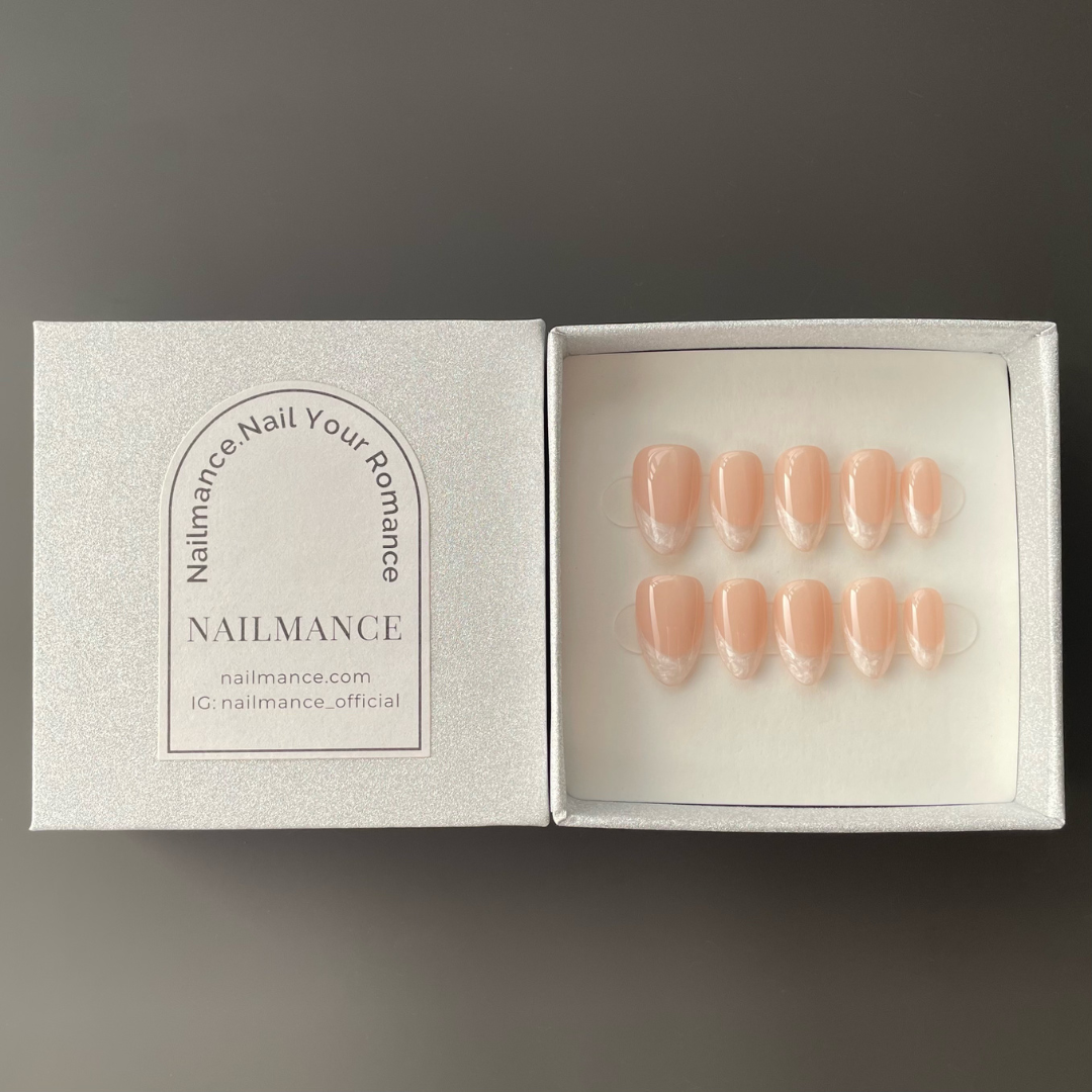 Elegant Silver Satin French Press-On Nails - Nude Short Almond, presented in the signature NAILMANCE box